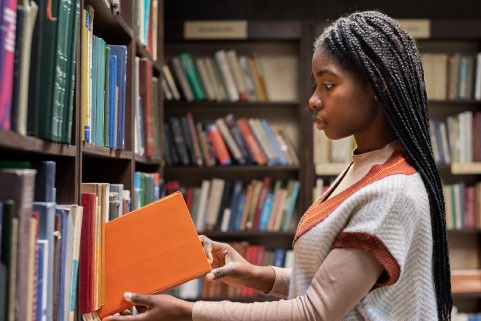 Picture of a student in a library